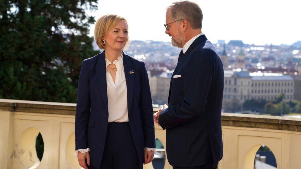 Liz Truss is welcomed by Prime Minister of the Czech Republic Petr Fiala, as she arrives at Kramar's Villa on 6 October