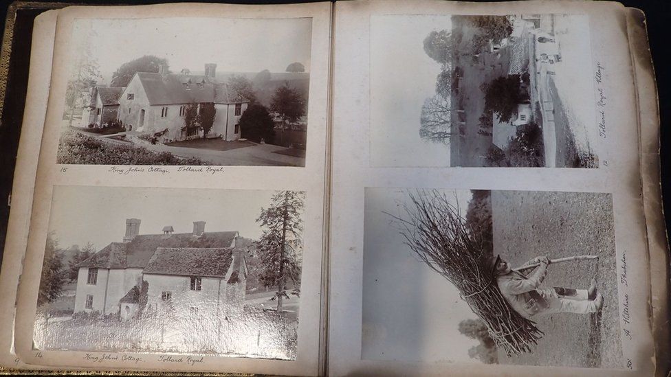 The open album showing four photos - three of houses and one of the thatcher.