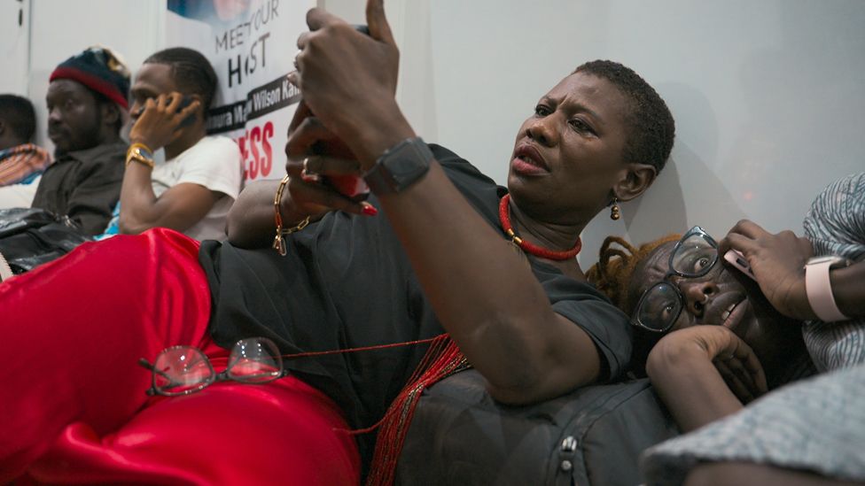 Yvonne Aki-Sawyerr and her daughter (R) at the APC headquarters in Freetown when tear gas was shot during political unrest in June 2023