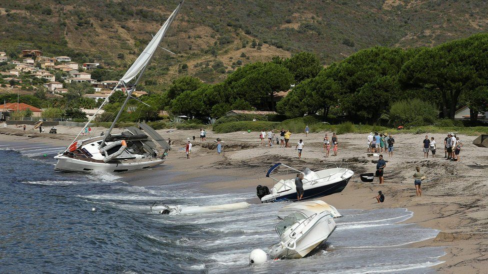 Boats thrown onto the beach of Sagone in Coggia, Corsica.