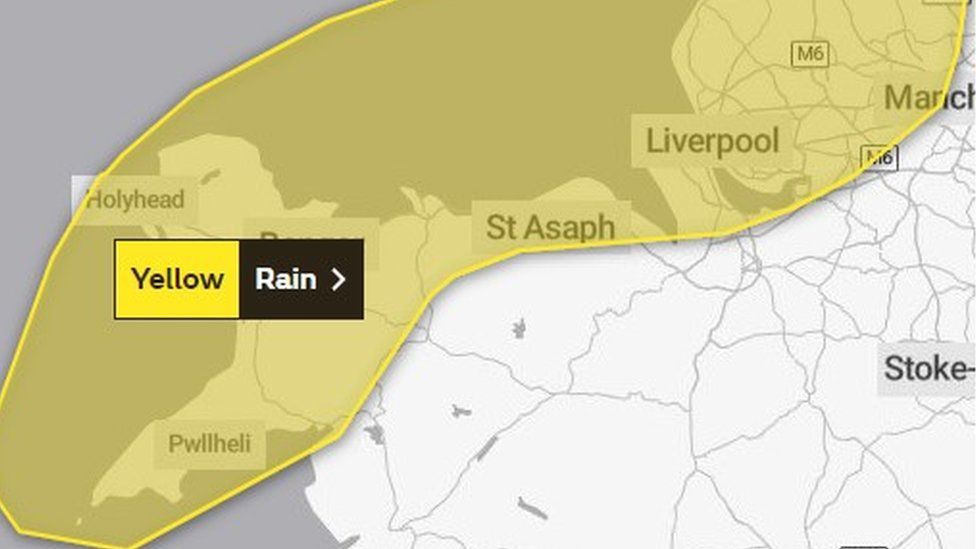 Map showing a yellow rain warning across the coastal areas of north Wales