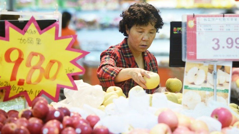A woman shopping in a supermarket in China.