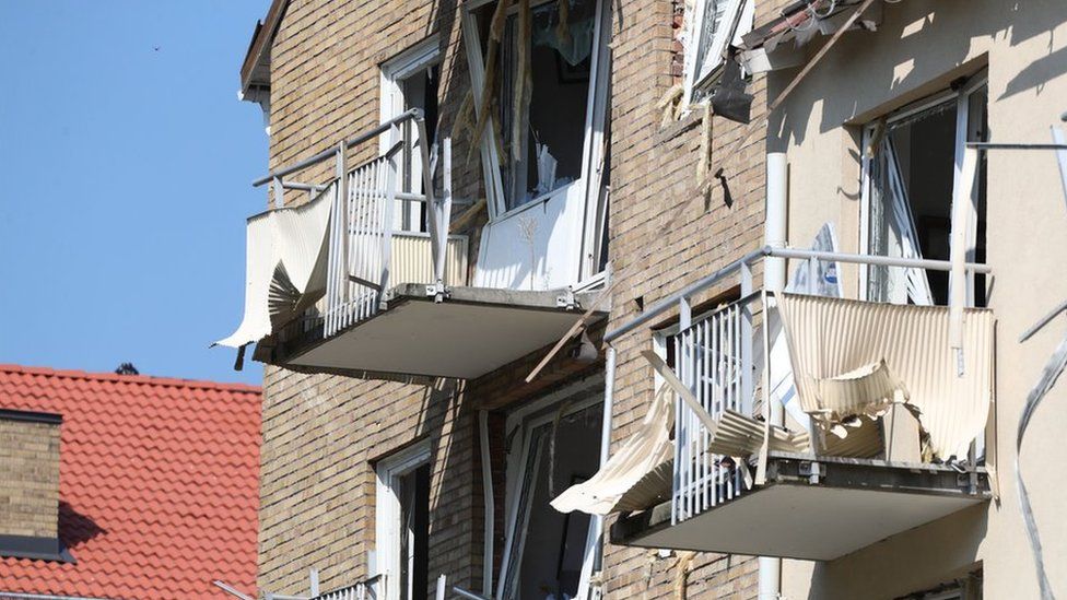 Damaged balconies and windows are seen at a block of flats that were hit by an explosion Friday morning, June 7, 2019