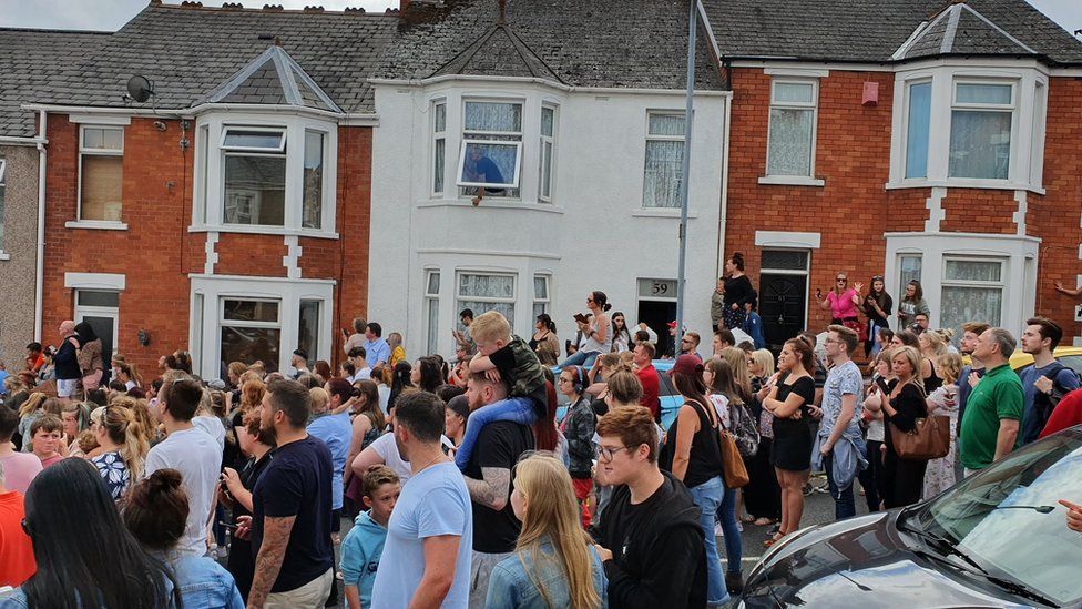 A crowd of people in the street where Gavin and Stacey is filmed