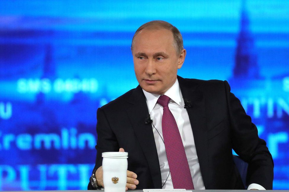 Russian President Vladimir Putin answers questions in Moscow, 15 June