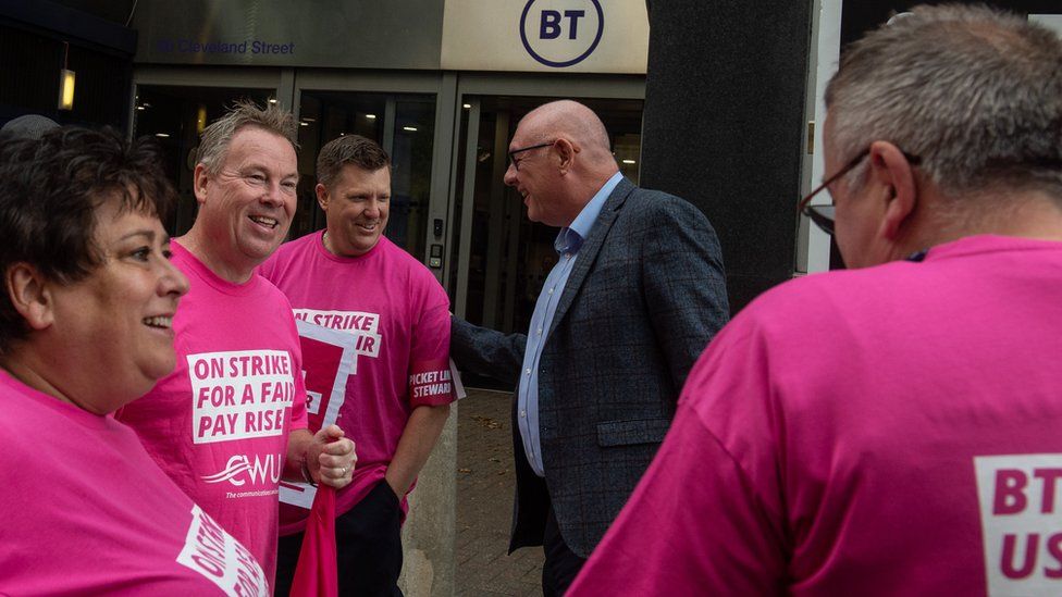 CWU head Dave Ward talks with striking workers on the picket line
