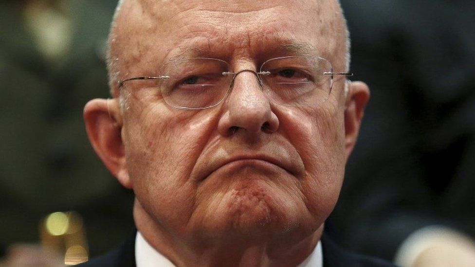 Director of National Intelligence James Clapper listens to remarks by U.S. President Barack Obama at DNI Office to mark its 10th anniversary, in McLean, Virginia, April 24, 2015.