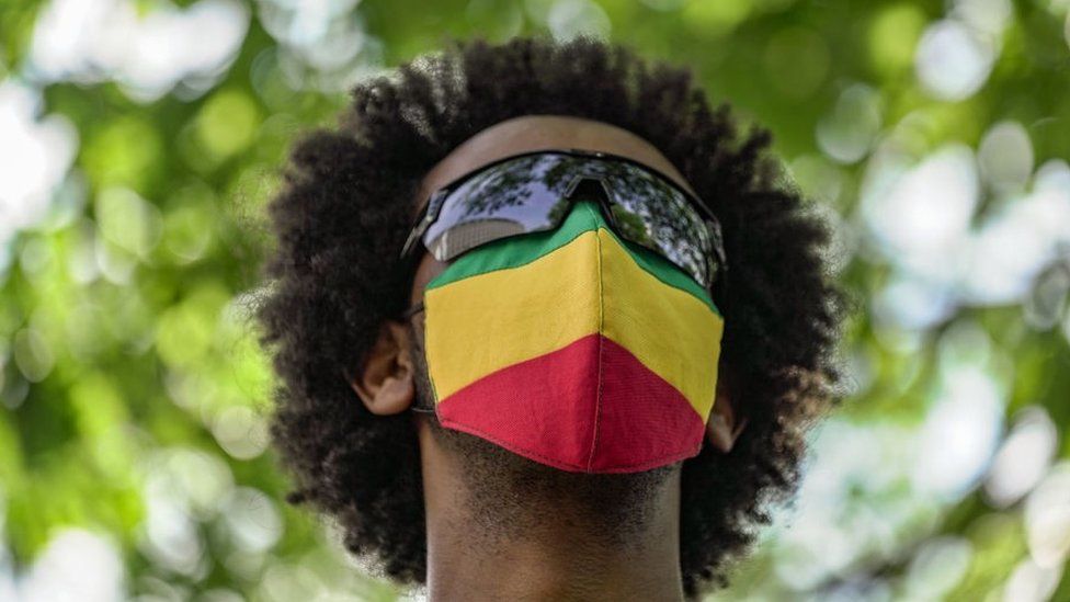 A member of the Ethiopian community wears an Ethiopian flag face mask at the US State Department to protest the ongoing murder and ethnic cleansing of members of the Amhara ethnicity in multiple regions in Ethiopia at the U.S. State Department on May 17, 2021 in Washington, DC.