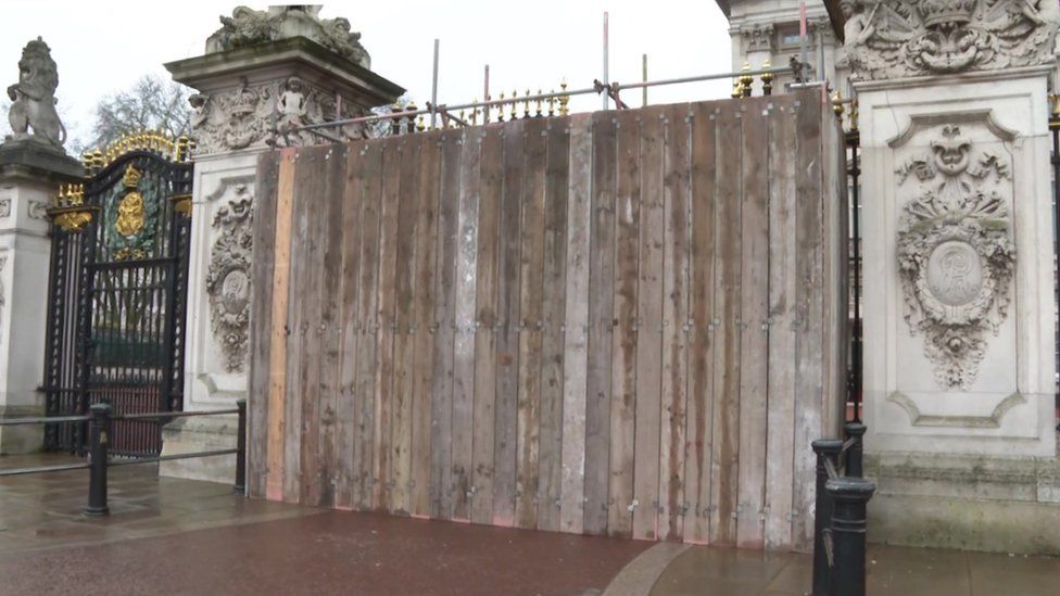 File image showing boards across main gates at Buckingham Palace