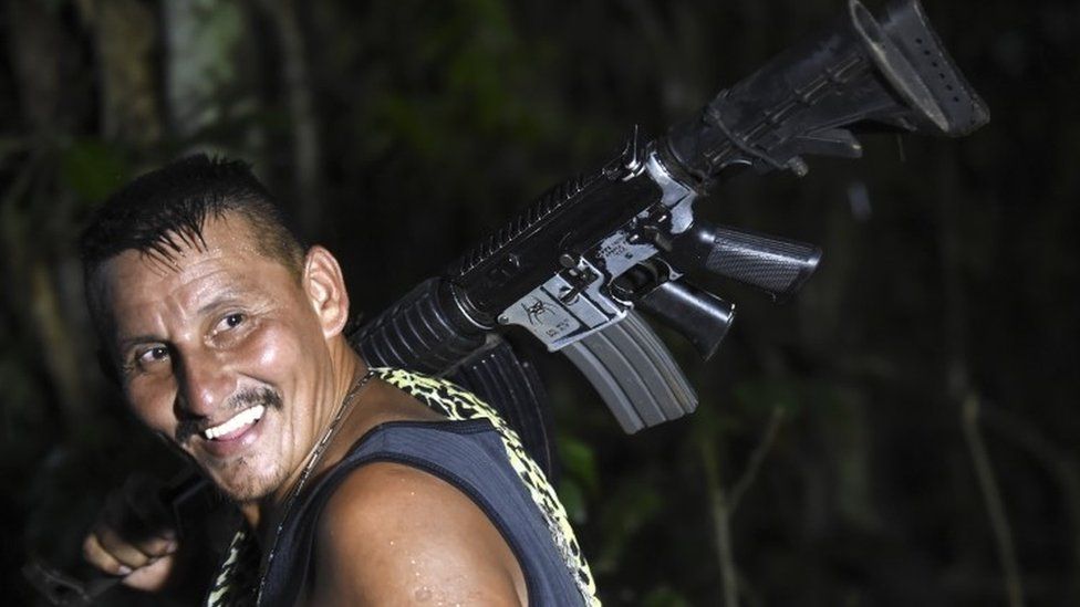 A member of the Revolutionary Armed Forces of Colombia (FARC) holds a weapon bearing a UN label. June 14 2017