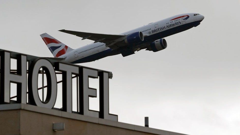 A British Airways aircraft is pictured as it takes off from behind the Sofitel hotel at Terminal 5 of London Heathrow Airport