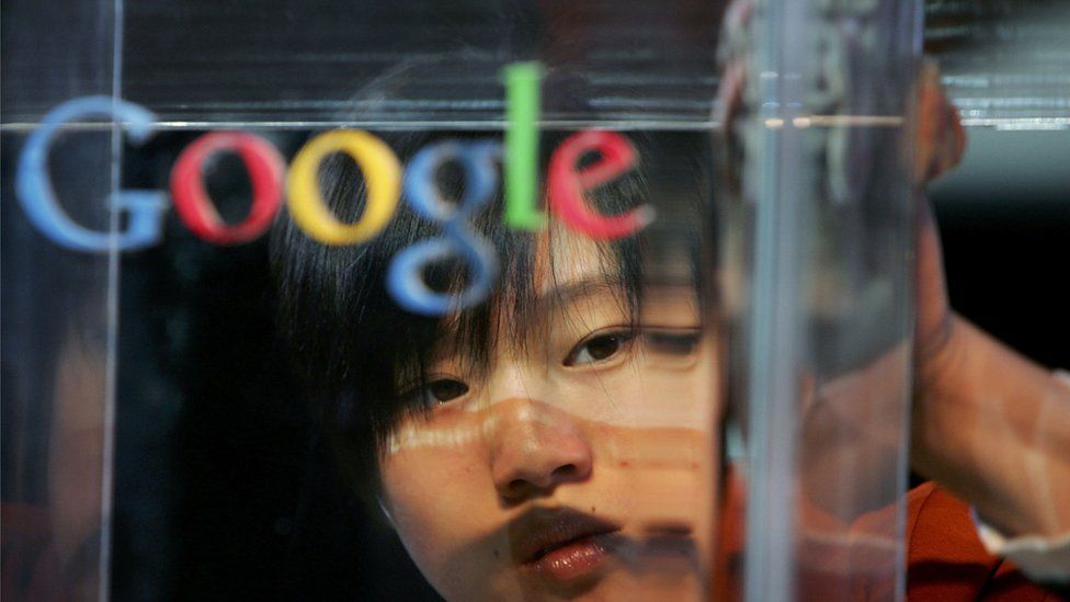 woman polishing Google sign