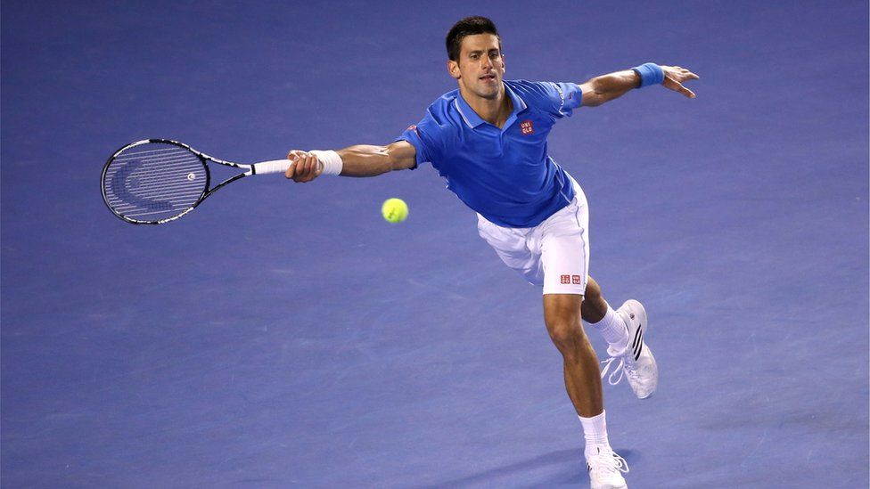 Novak Djokovic of Serbia plays a forehand in his men's final match against Andy Murray of Great Britain during day 14 of the 2015 Australian Open