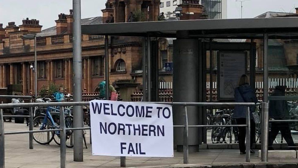 A sign saying "Welcome to Northern Fail" at Manchester Piccadilly
