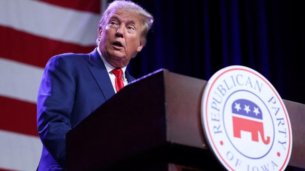 Donald Trump speaks to guests at the Republican Party of Iowa dinner