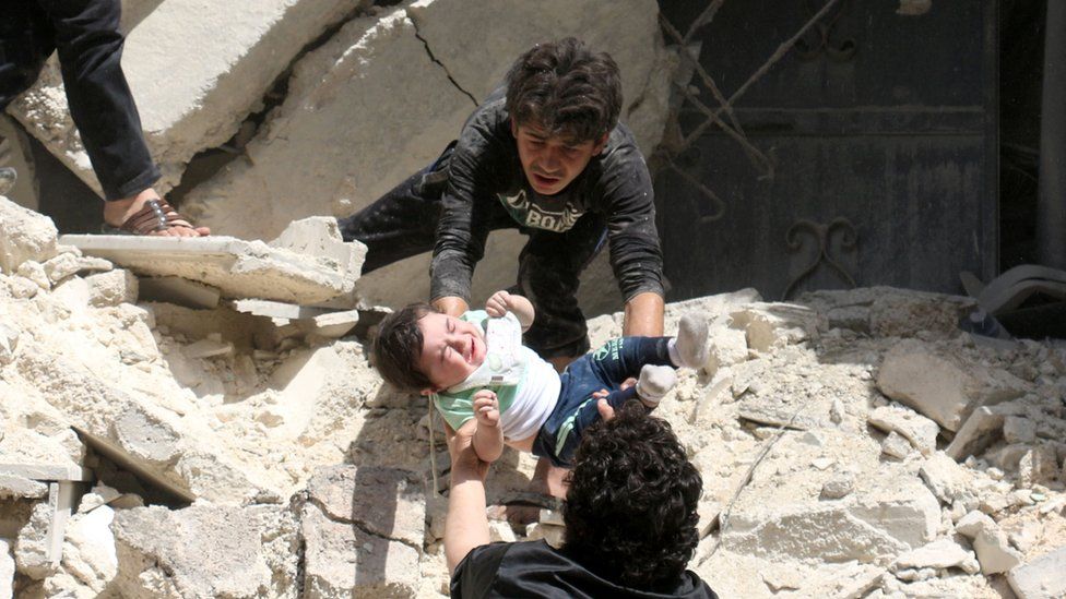 Baby passed out from rubble of destroyed building in Aleppo. 28 April 2016