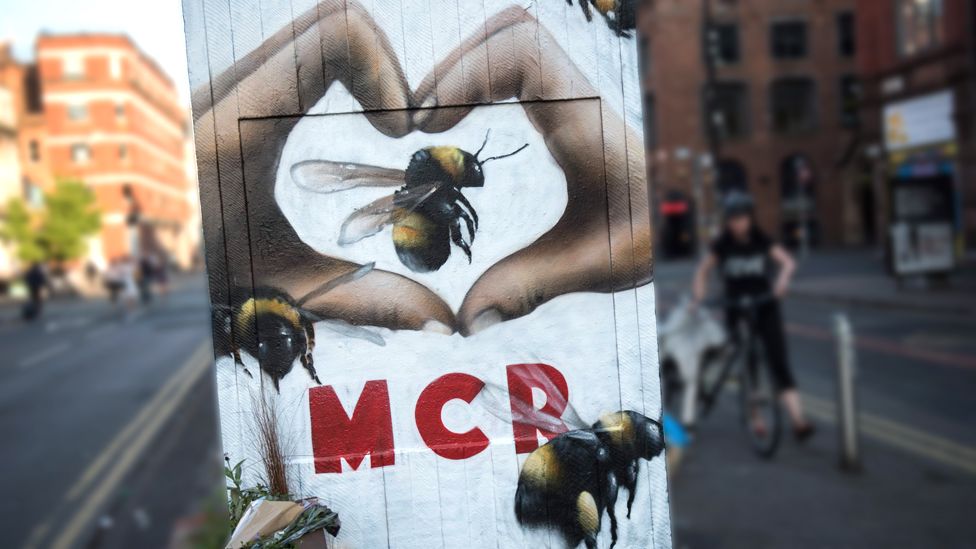 A street-art mural, created following the Manchester Arena bombing, featuring bees, which are a symbol of the city's industrial heritage Stevenson Square, Manchester, 25 May 2017.