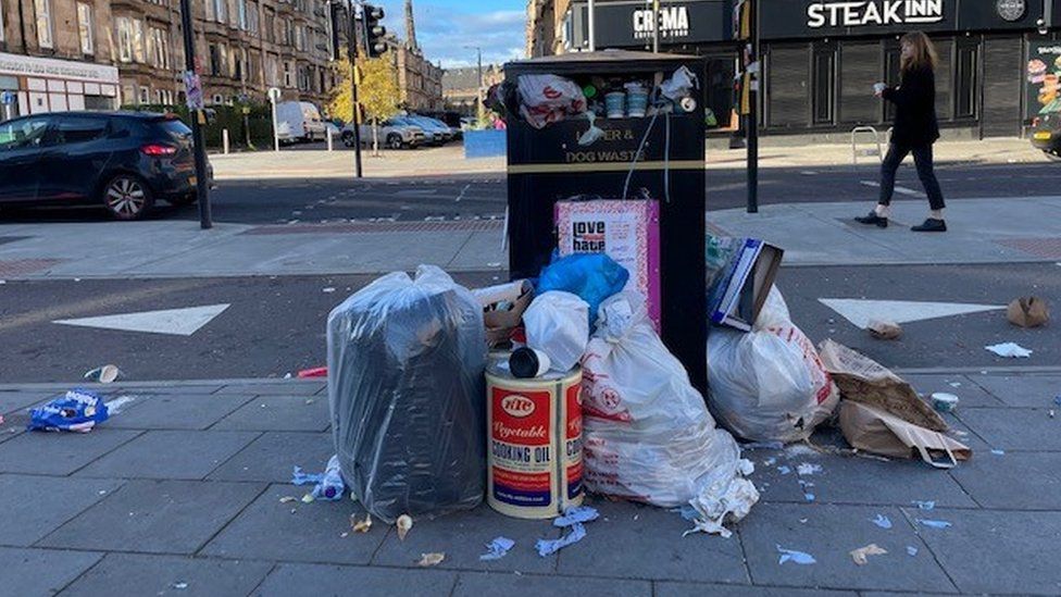 Bags of refuse are overflowing bins in Glasgow