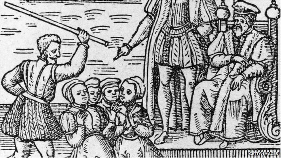 A woodcut of a witch trial