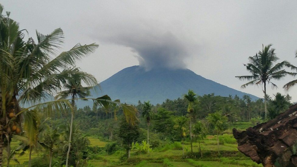 Towering clouds of smoke on the summit of Mount Agung in the holiday island of Bali.