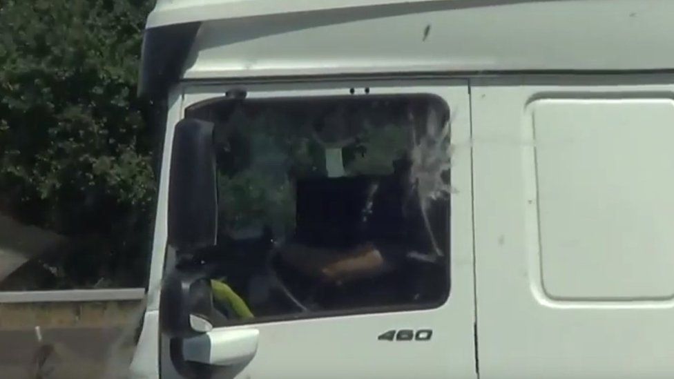 Driver watching a video on a laptop