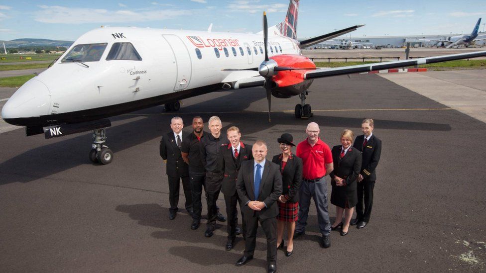 Loganair plane and staff pictured in 2017