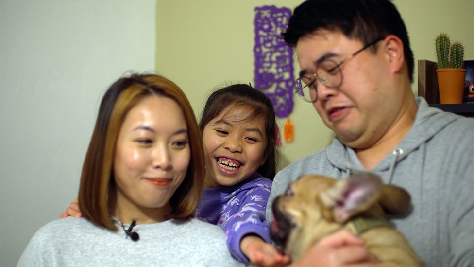 Yowin, Hayley and Eddie with their dog