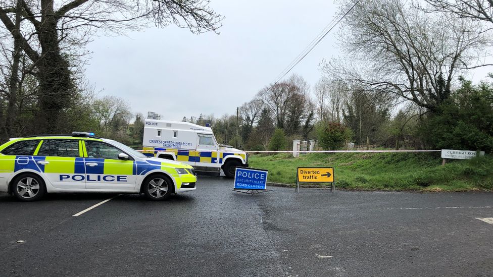 Police vehicles at the closed Ballyquin Road near Dungiven