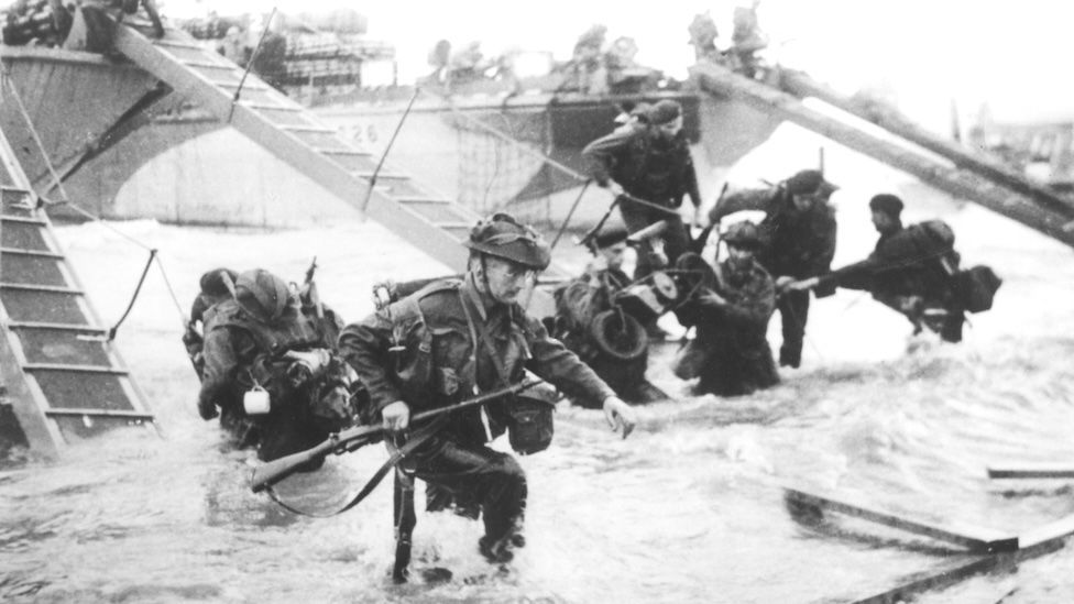 Members of the Royal Marines running onto Juno Beach during the D-Day landings