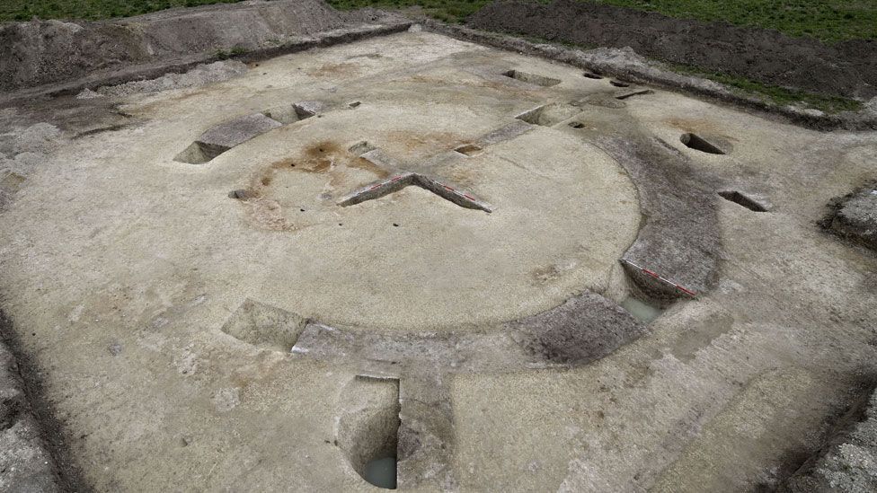 An aerial view of an excavation of medieval mill showing the cross or X of its foundation and banks surrounding it, Cherry Hinton, Cambridgeshire 