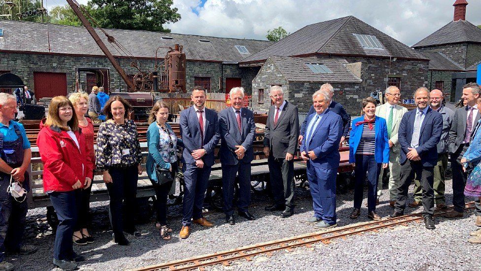 Then First Minister Mark Drakeford and others at the National Slate Museum in 2021
