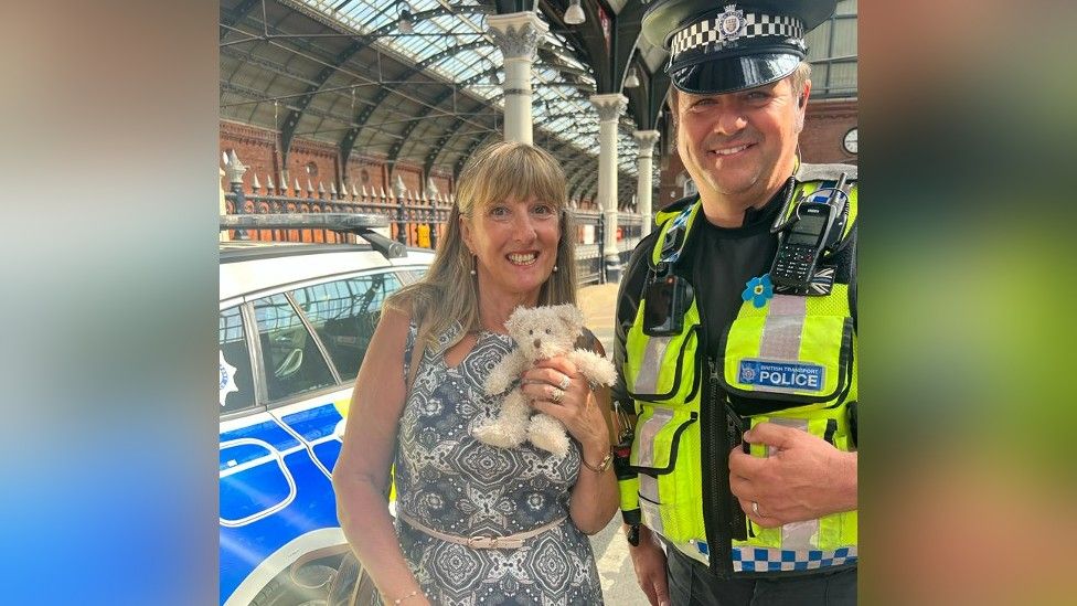 Linda Lawson with the teddy bear and PC Rob Simpson at Darlington station 