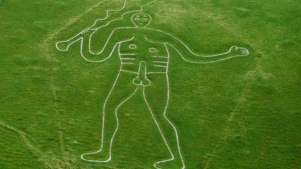 Cerne Abbas Giant outlined in white on grass in Dorset