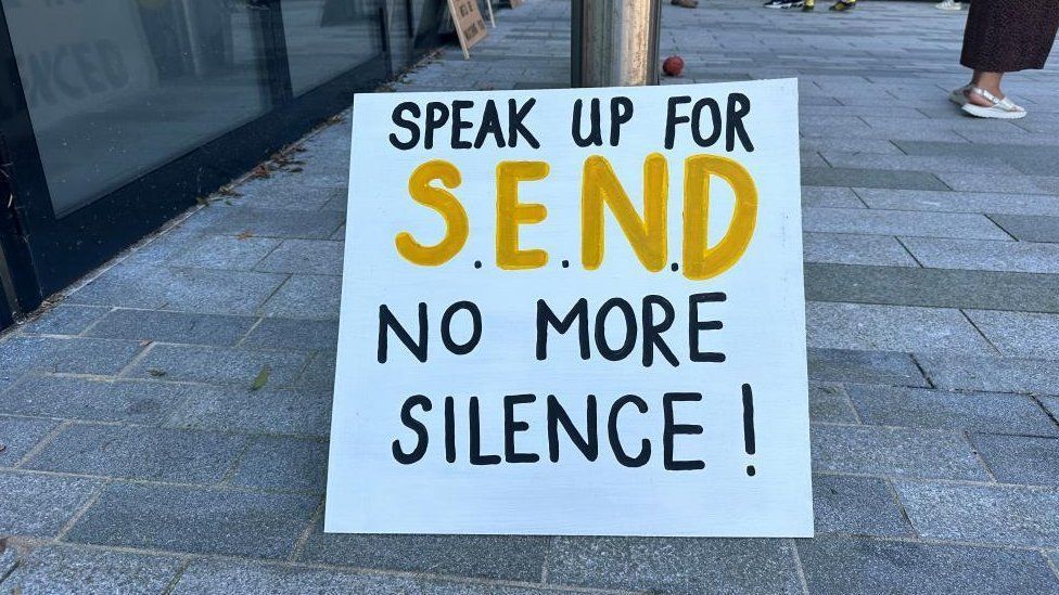 A protest sign which reads "speak up for SEND, no more silence"
