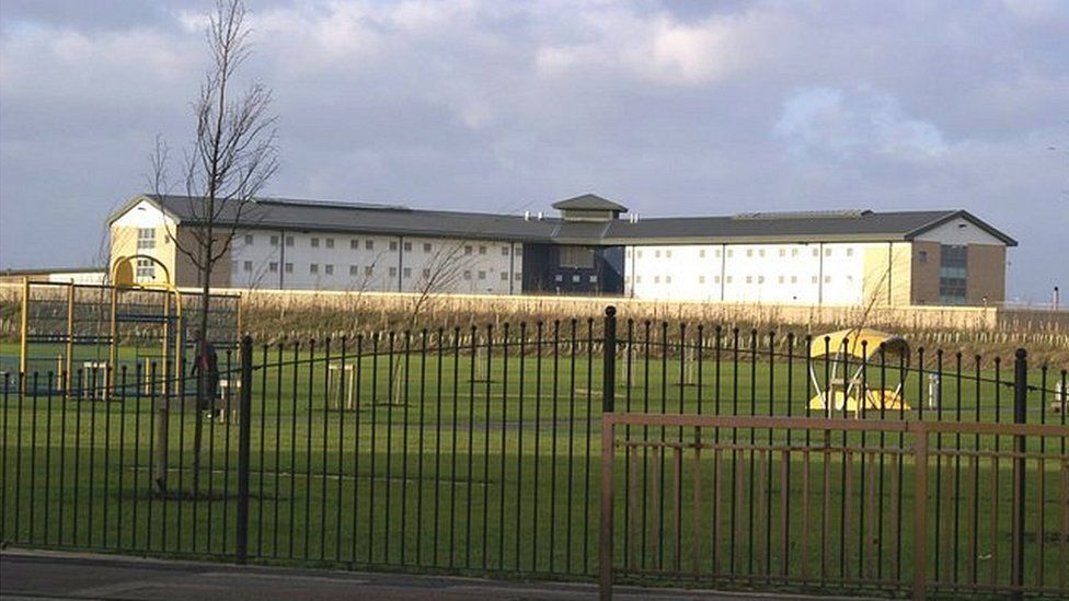 Man charged with murder after assault at HMP Peterborough - BBC News