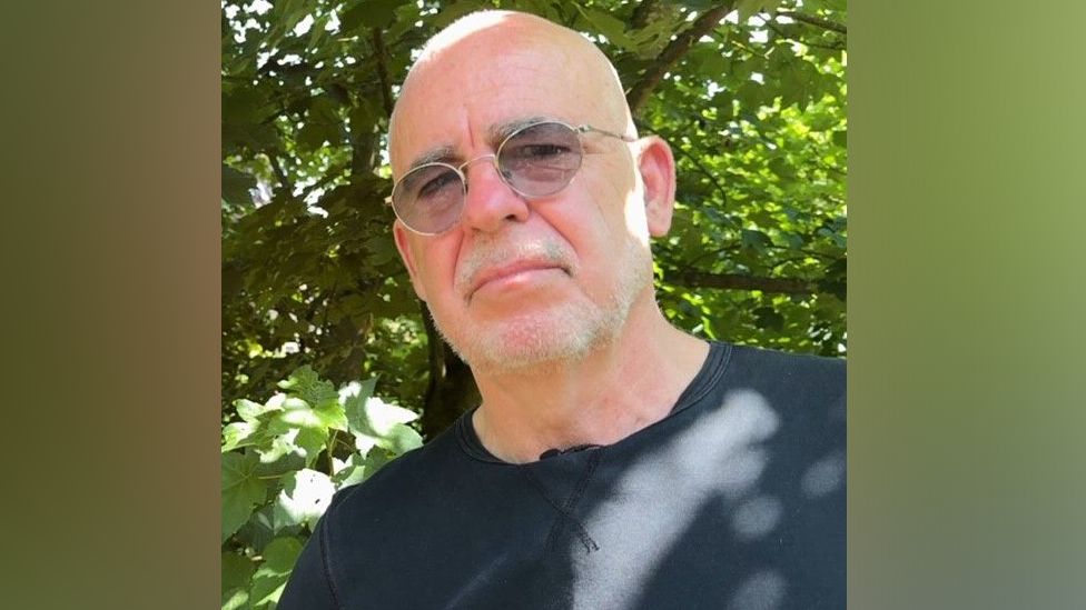 Green Party campaigner Pat McCarthy looking concerned with a tree behind him