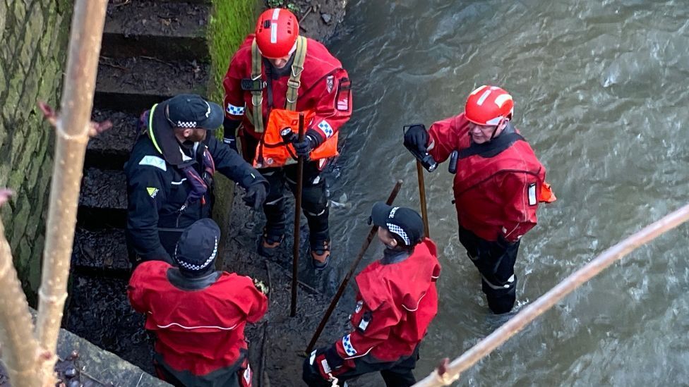 Officers in red clothing searched a section of Edinburgh's Union Canal