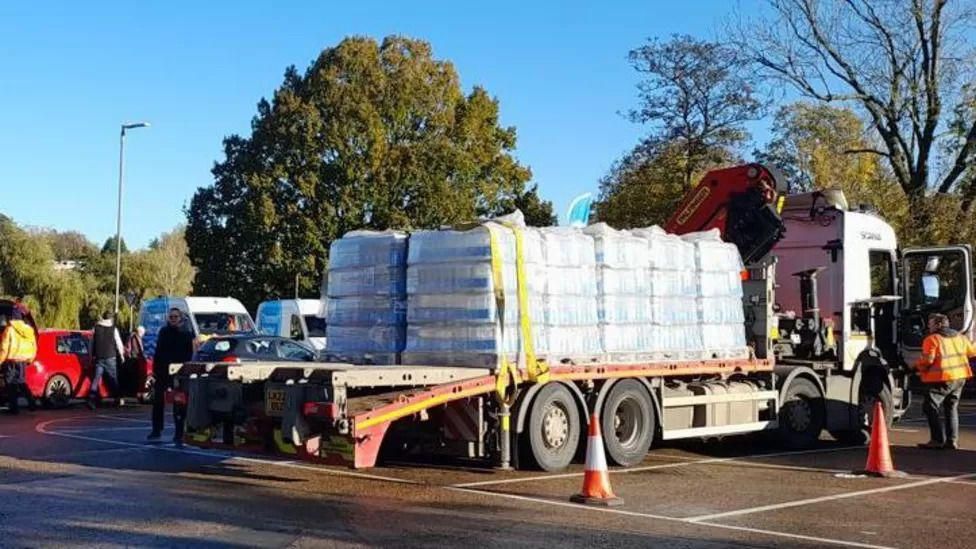 A lorry carrying a large number of water bottles