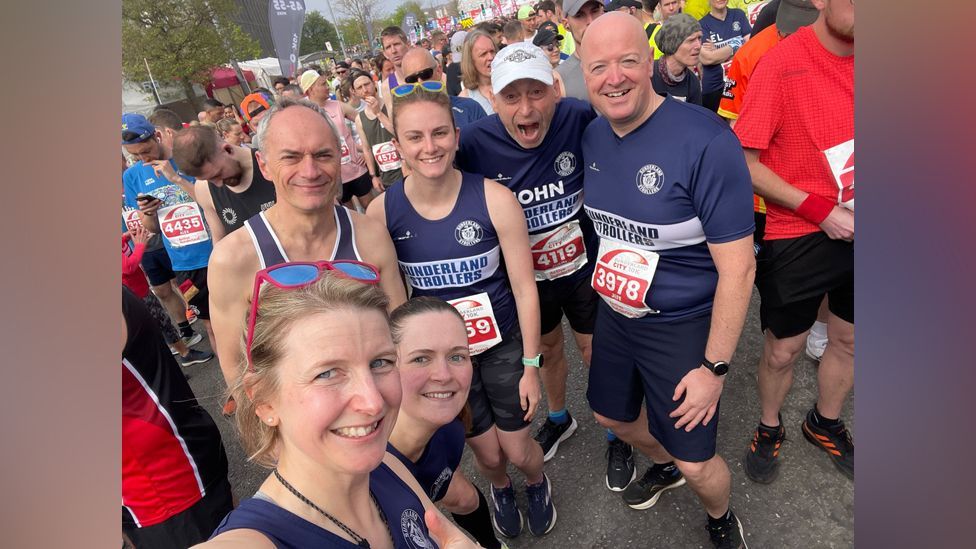 A selfie shot of a group of runners 
