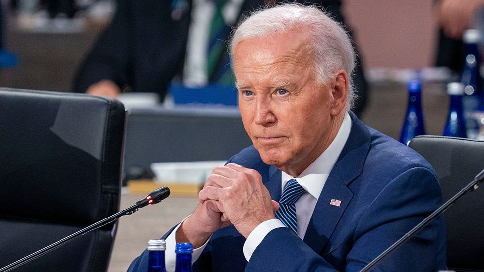 Joe Biden looks on during a Nato meeting on 10 July
