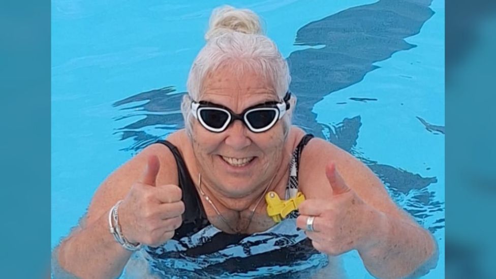Clare Marshall with goggles on in the lido