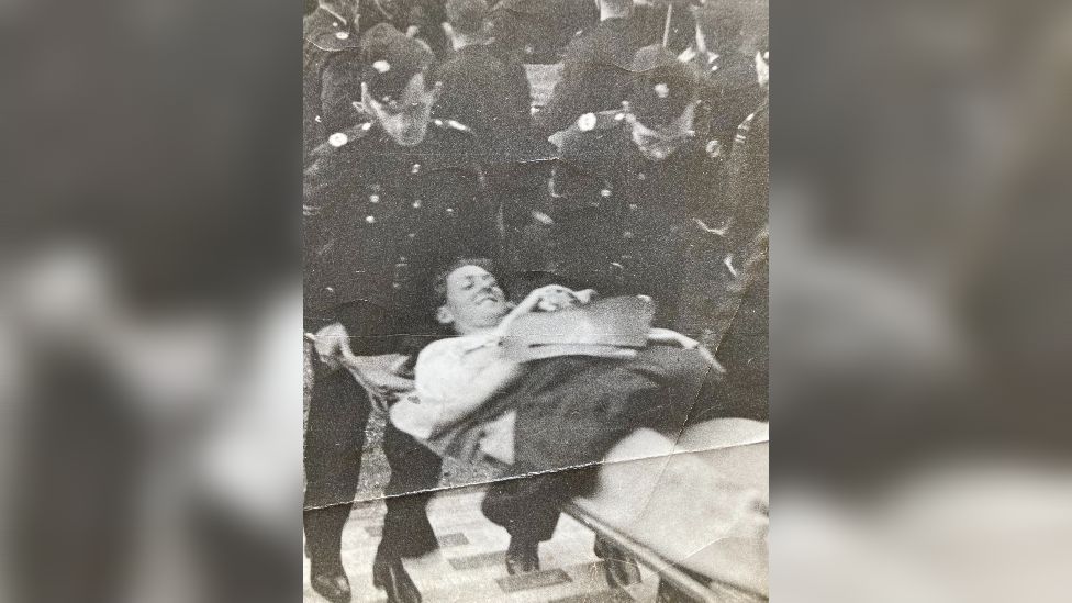 Black and white image of Lt Willis on a stretcher