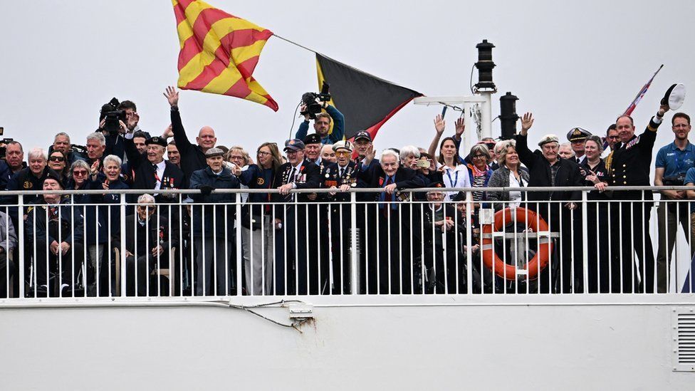 Veterans on Brittany Ferries ship Mont St Michel smiling and waving