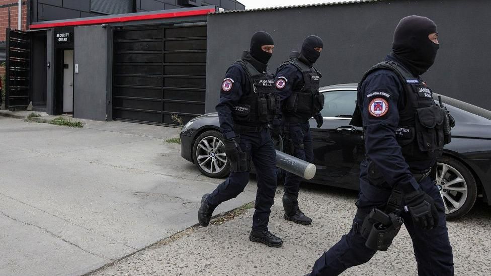 Police officers outside the Tate brothers residence in Pipera, Ilfov, near Bucharest, Romania, August 21, 2024