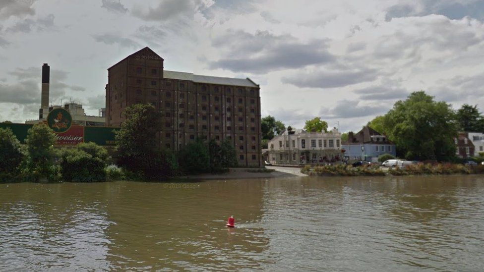 A StreetView image showing the old brewery building from the River Thames in Mortlake