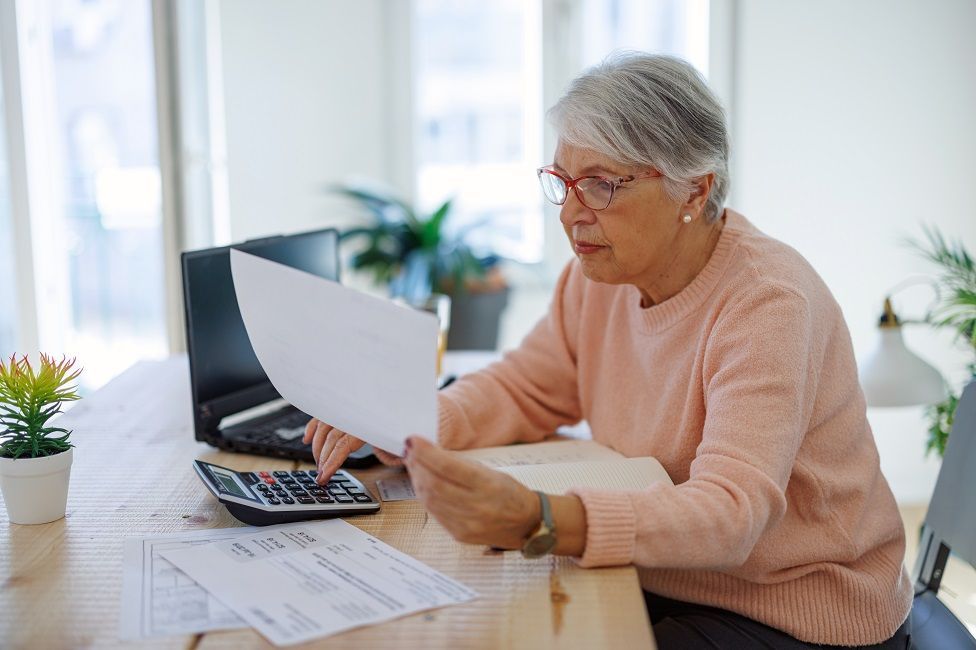 Elderly person with an energy bill