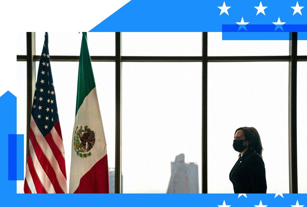 Kamala Harris walks toward two flags - the American flag and Mexican flag 