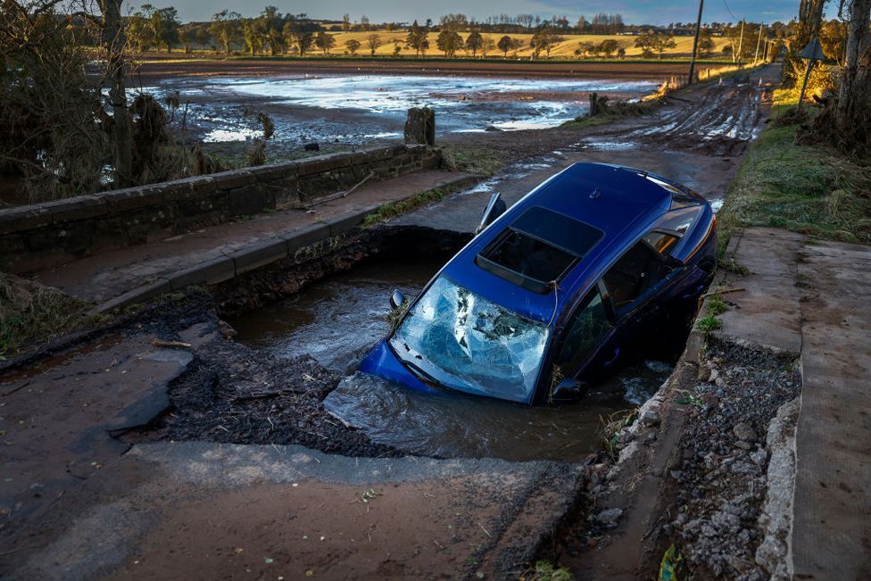 A car is seen in on bridge washed away following yesterdays torrential rain on October 21, 2023 in Dundee, Scotland.