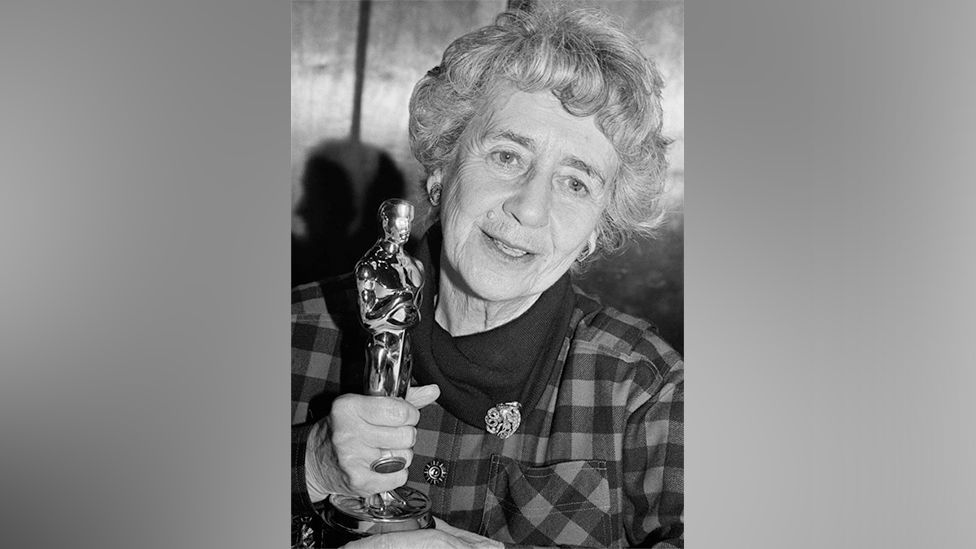 Dame Peggy Ashcroft holding the Academy Award for Best Supporting Actress