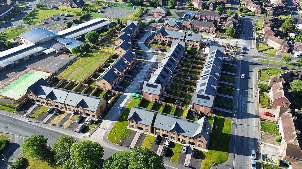 Aerial view of the Grange Park estate- rows of houses with gardens front and back 